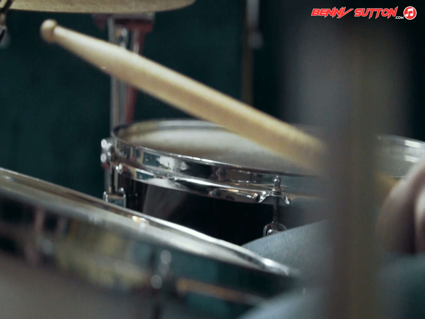 close up shot of drum kit toms and drumstick