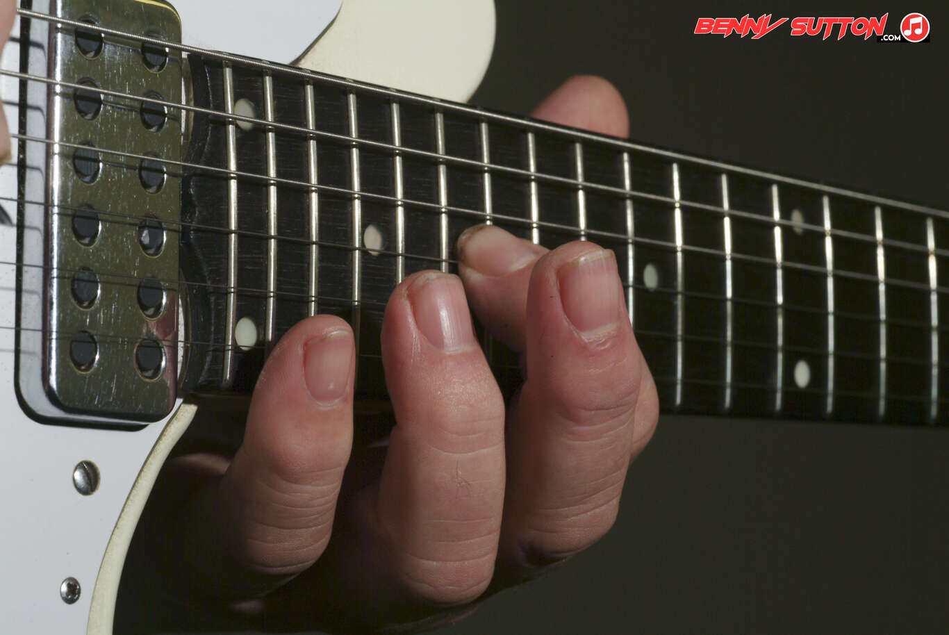 Guitarist playing high on the fretboard 